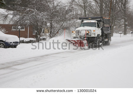 Snow Plow Removing Snow From Street    Stock Photo
