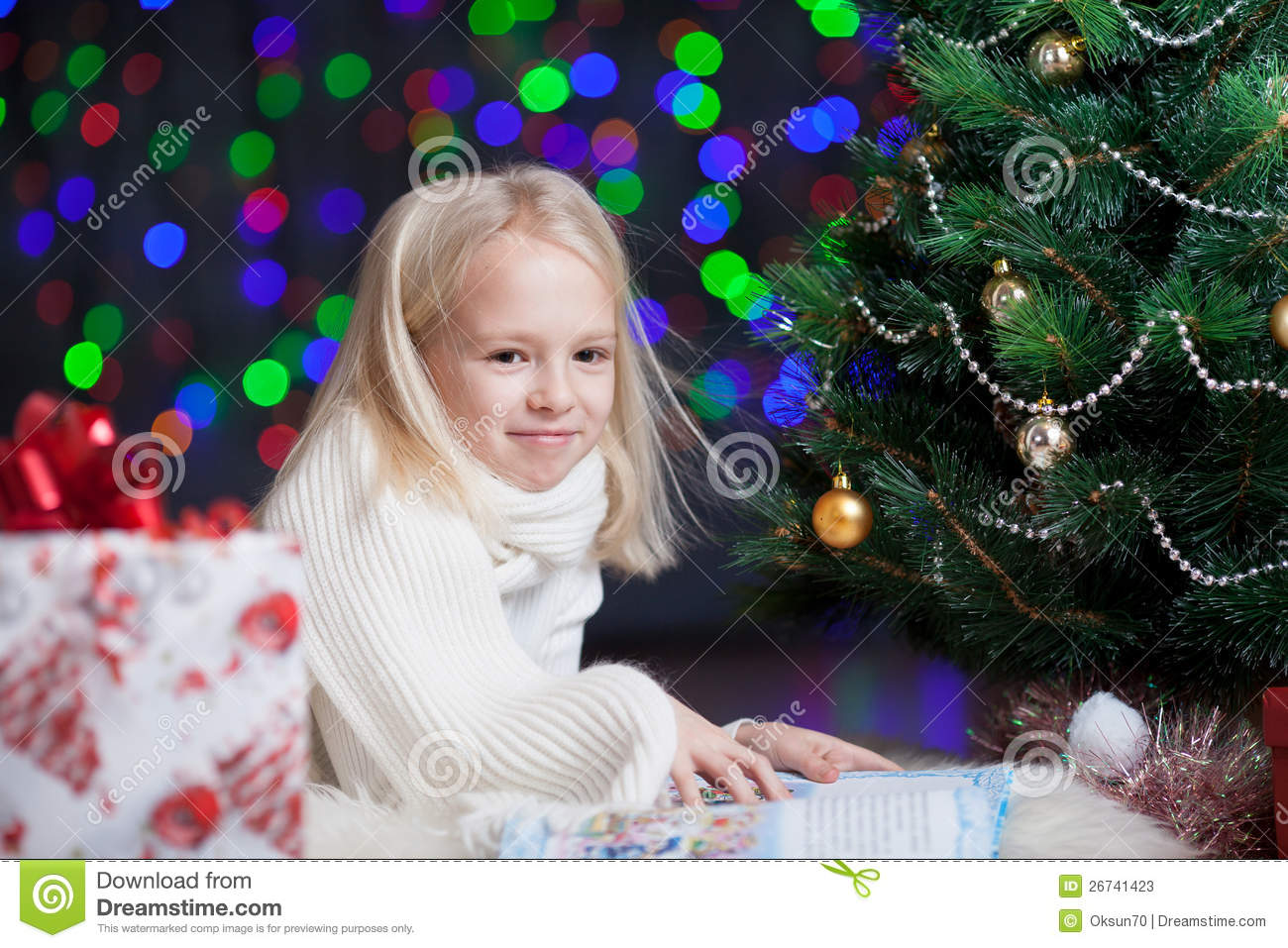 Child Girl Reading Book Under Christmas Tree Stock Photos   Image    