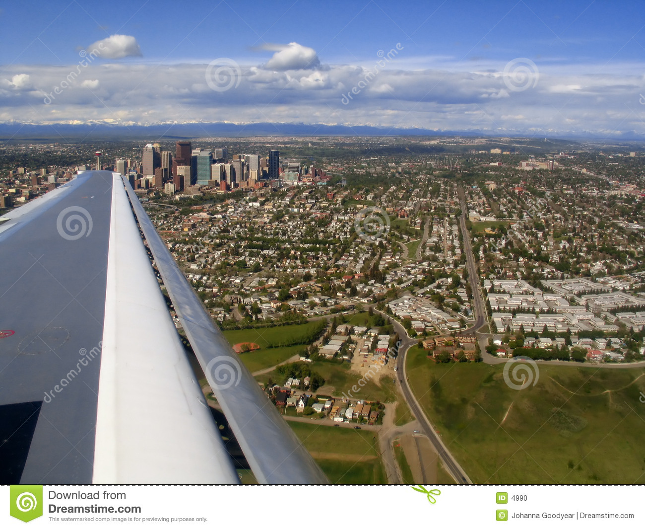 Aerial Shot Over Calgary Alberta  Rocky Mountains In The Distance 