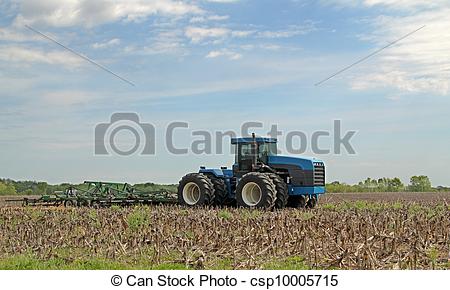 Stock Photography Of Blue Tractor Plowing   Blue Tractor Pulling Plow
