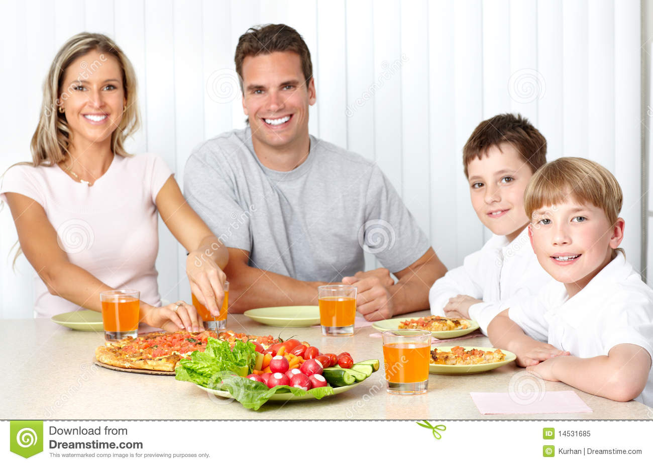 Family Pizza   Father Mother And Children Eating A Big Pizza
