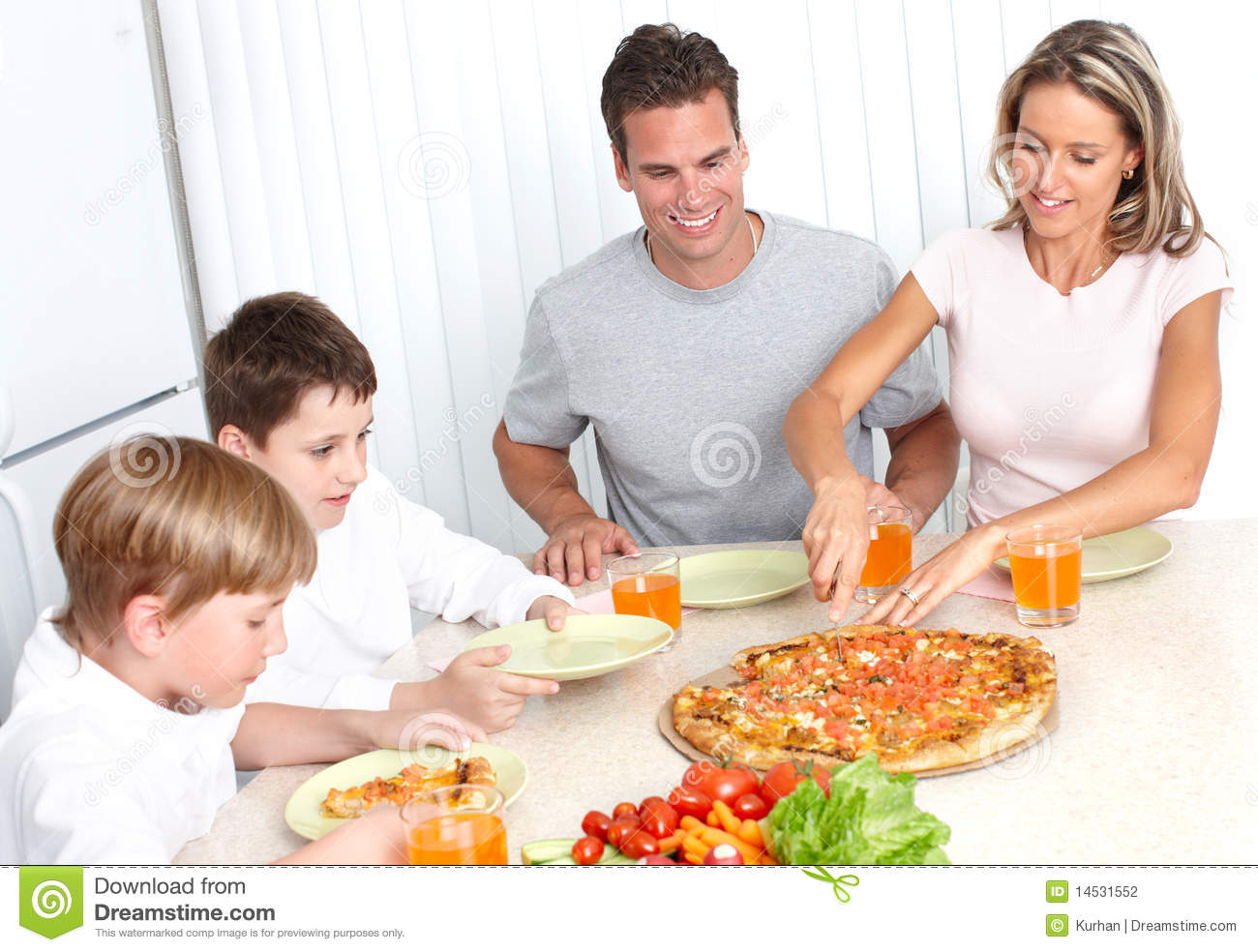 Family Pizza   Father Mother And Children Eating A Big Pizza 