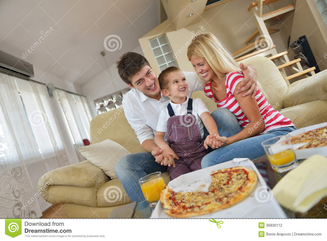 Happy Young Family Eating Tasty Pizza With Cheesa And Dring Healthy    