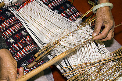 Chinese Woman Weaving With A Traditional Manual Handcraft Loom   