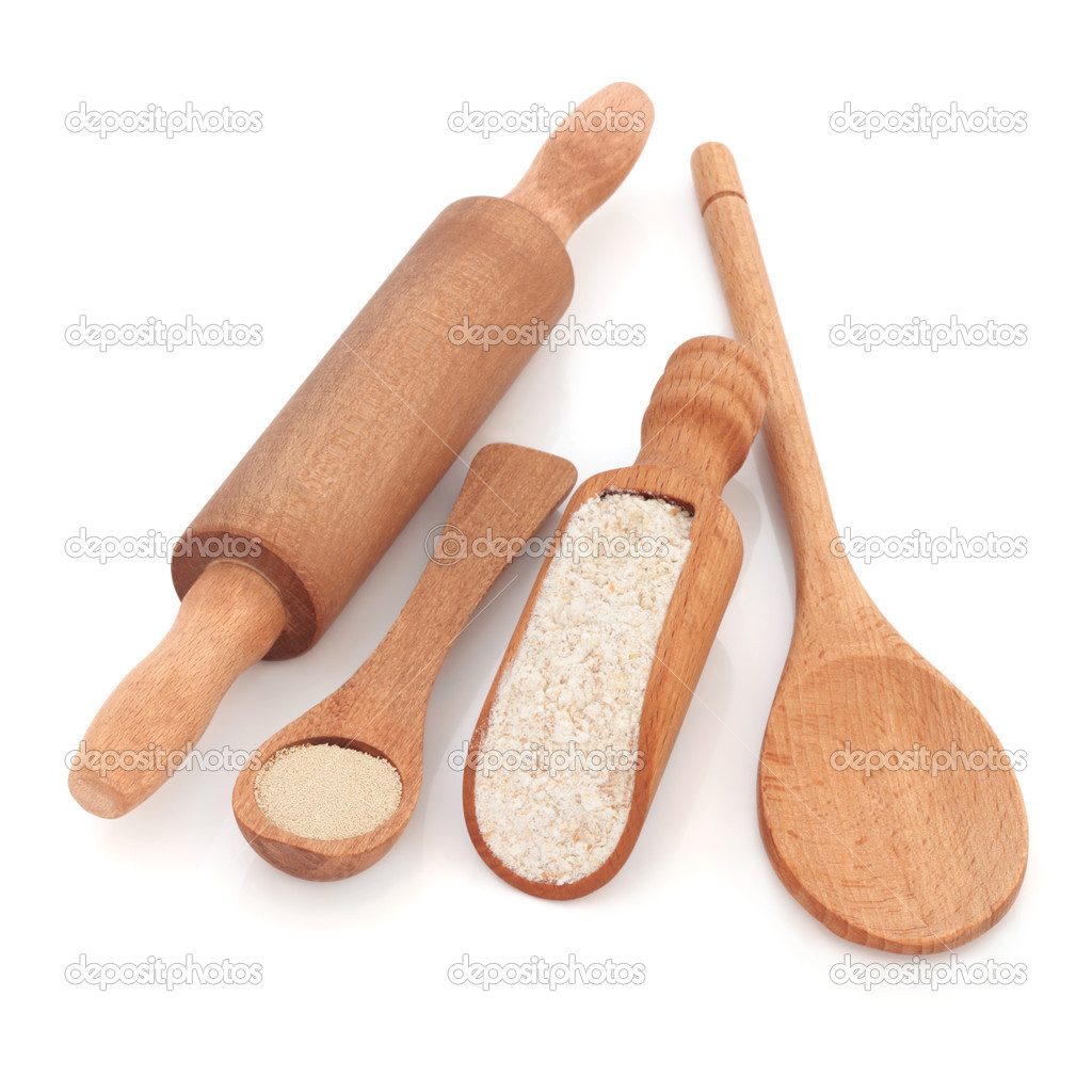 Rustic Wooden Baking Utensils Of Scoop Spoons And Rolling Pin With