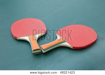 Ping Pong Paddles On A Board