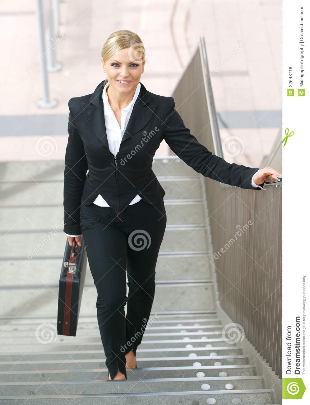 Confident Business Woman Walking Upstairs With Bag Royalty Free Stock    