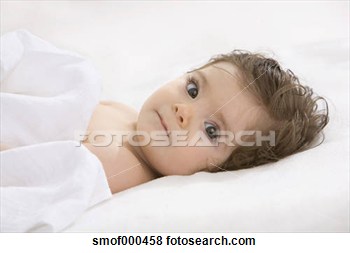 Stock Photo   Baby Girl Lying On Back Covered With Blanket Portrait