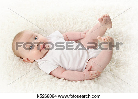 Stock Photo   Baby Lying On Back Sticking Tongue Out  Fotosearch    
