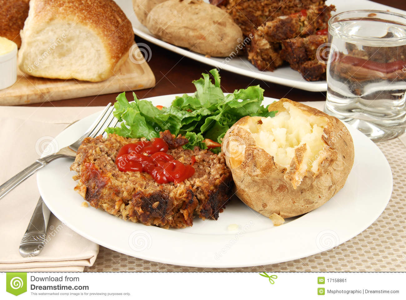 Supper Of Meatloaf Baked Potato And Fresh Hot Bread 