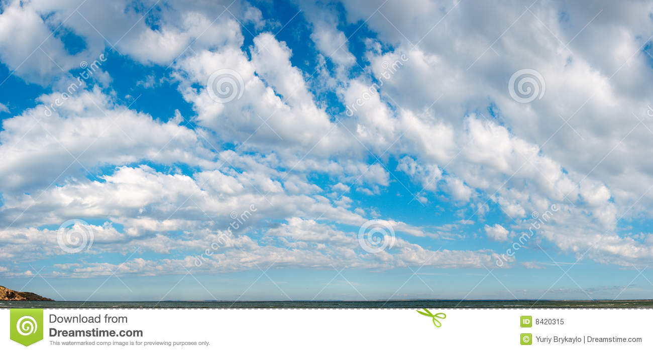 Blue Height Sky Above The Sea Surface With Clouds  Four Shots Stitch