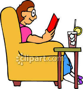 Person Sitting In A Chair And Reading A Book With A Cold Drink