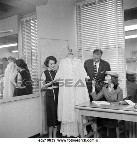 1950s Female Fashion Buyer Selecting Lingerie Clothing In A Garment    