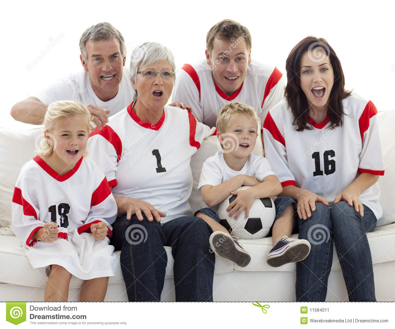 Excited Family Watching A Football Match In Television At Home