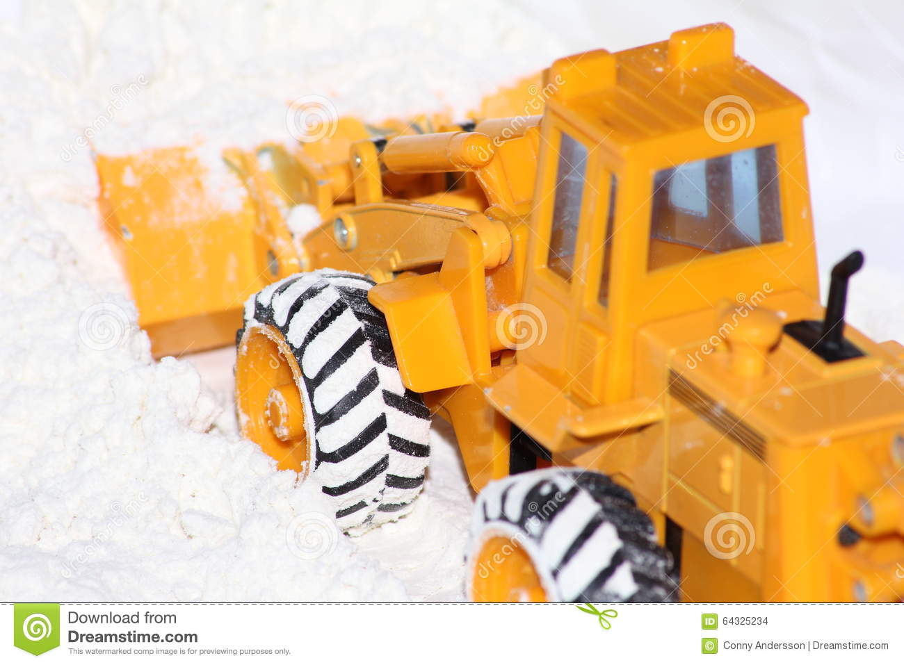 Toy Yellow Tractor Plowing Some Snow