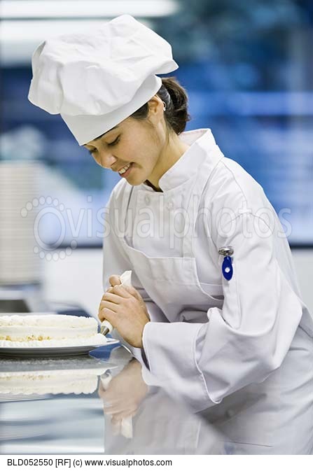 Asian Female Pastry Chef Decorating Dessert