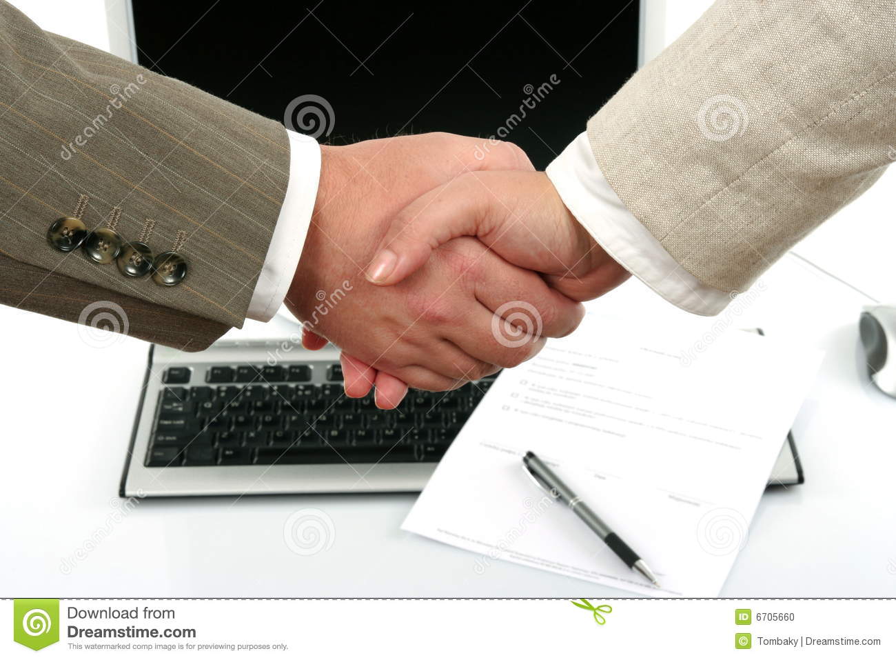 Man And Woman Shaking Hands In Front Of Computer And Document With Pen