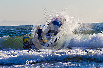 Fishing Surf Ski Boat Hits A Small Wave At First Light For The Largest    