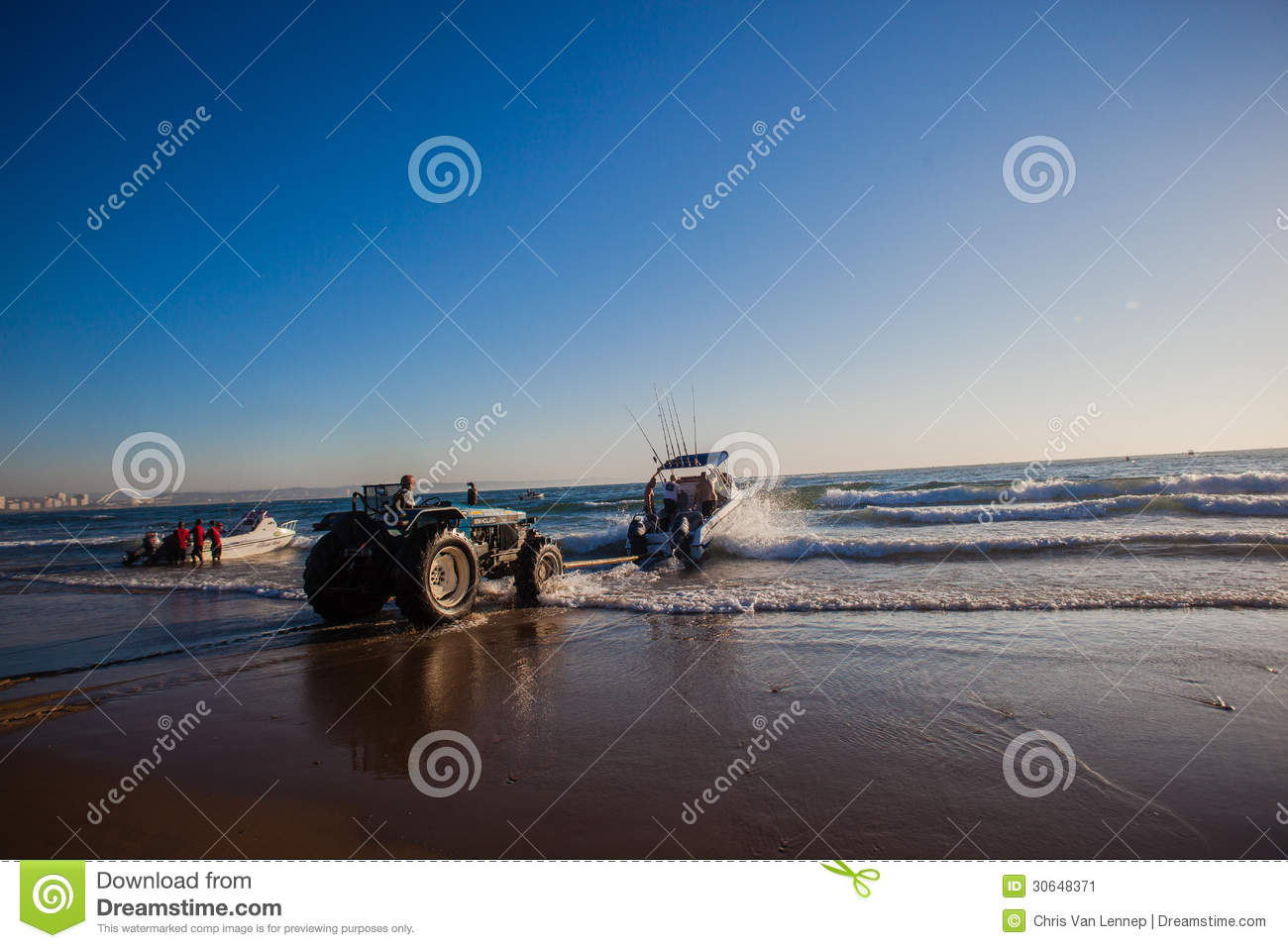 Fishing Surf Ski Boat Pole Pushed Into The Ocean Surf By A Tractor  