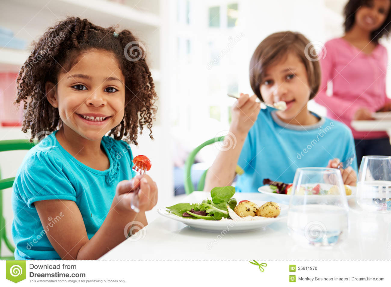 African American Family Eating Meal At Home Together Stock Photo    