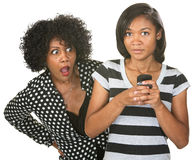 Shocked Mother And Texting Teenager Royalty Free Stock Photography
