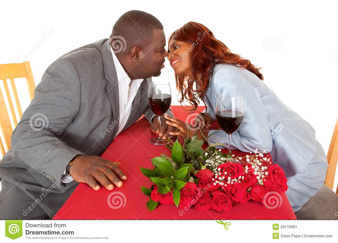 African American Couple About To Kiss In Romantic Dinner Stock Image    