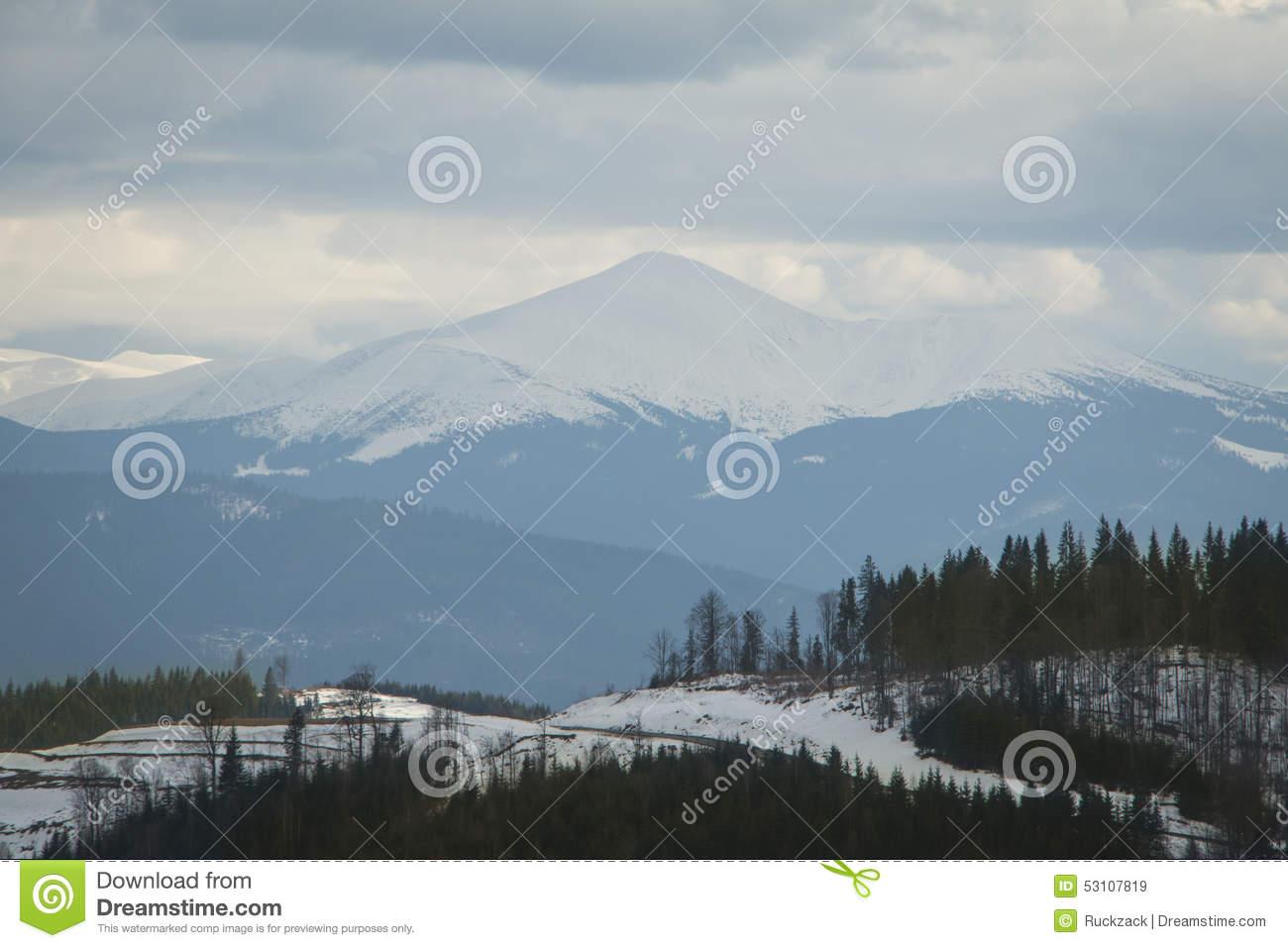 High Snowy Mountain In Foggy Weather And Clouds 