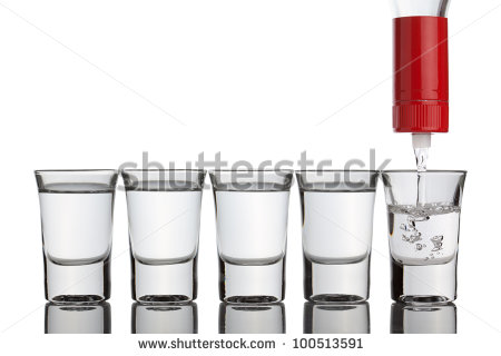 Vodka Pouring Into Shot Glasses Standing In Row Isolated On The White