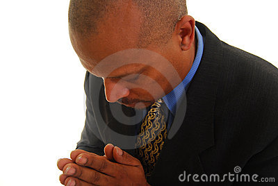 African American Man With Eyes Closed And Hands Clasped Praying