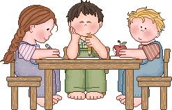 Children Sitting At A Table Working Together