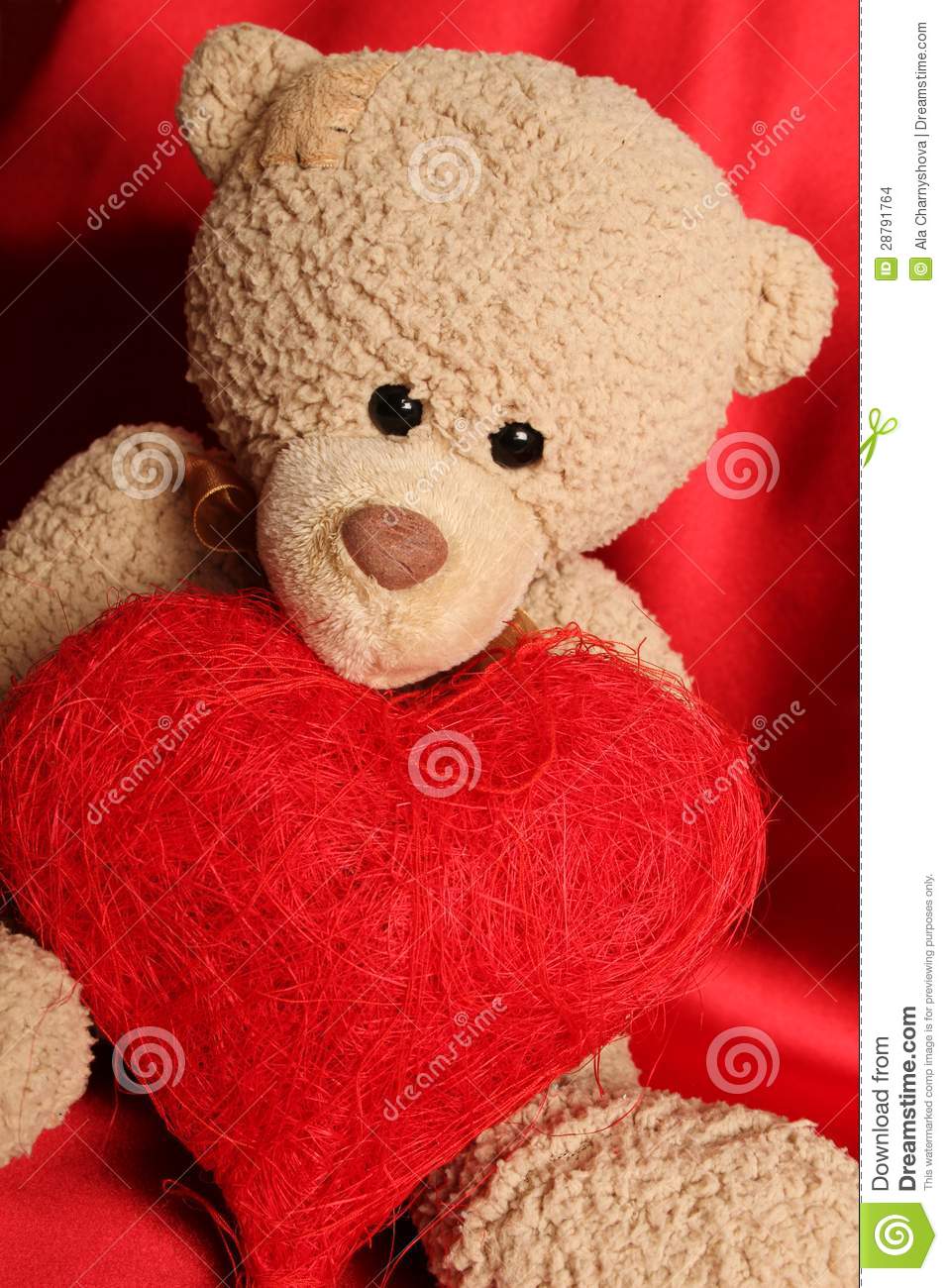 Close Up Of A Teddy Bear Holding A Big Gift Box As Heart