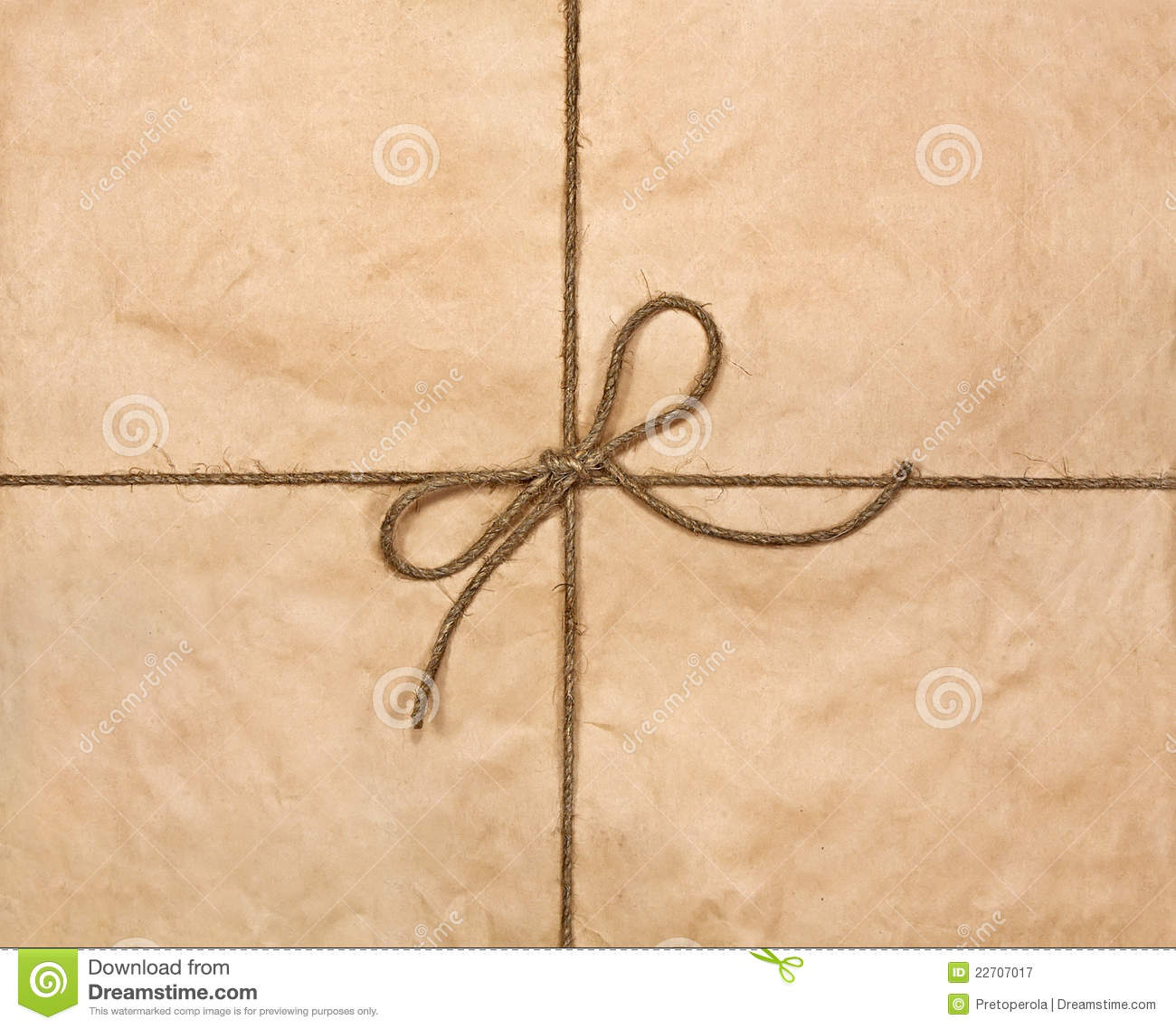     Free Stock Photography  String Tied In A Bow On A Brown Recycled Paper