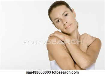 Woman Folding Arms Across Chest Looking At Camera View Large Photo