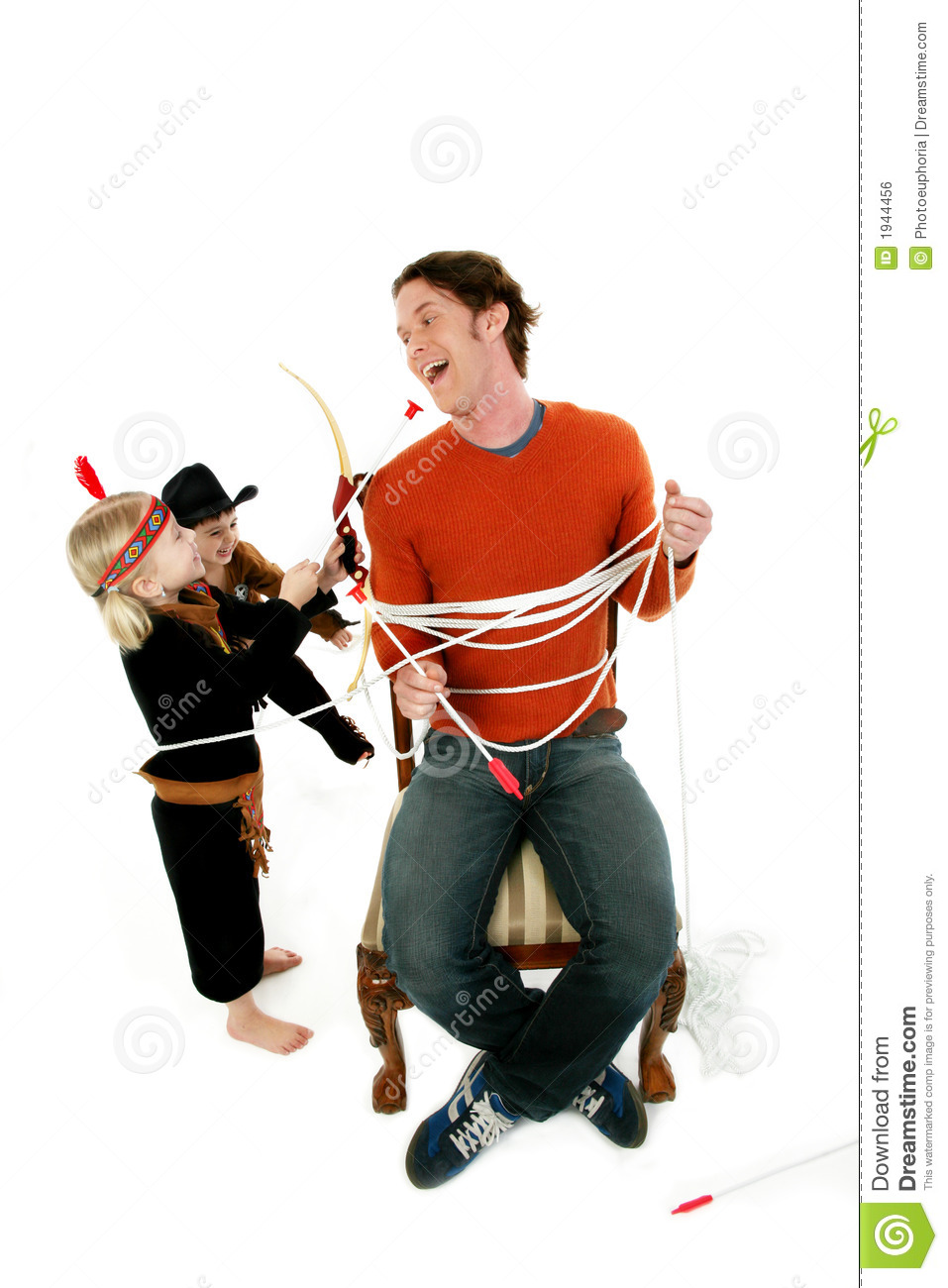 Worn Out Man Playing Cowboys And Indians With Young Boy And Girl 