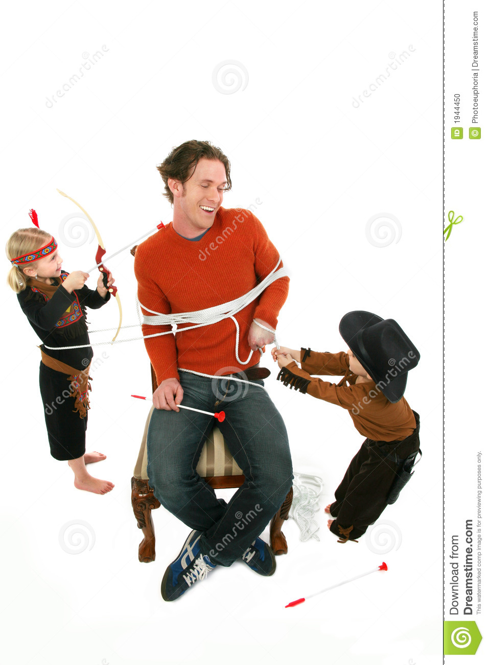 Worn Out Man Playing Cowboys And Indians With Young Boy And Girl 