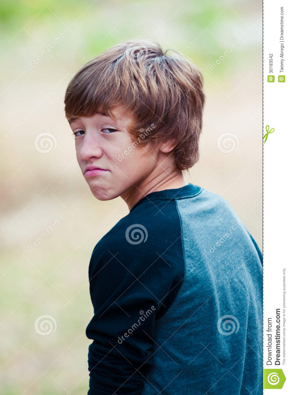 Young Teen Looking At Camera With Frown Face Stock Photography   Image