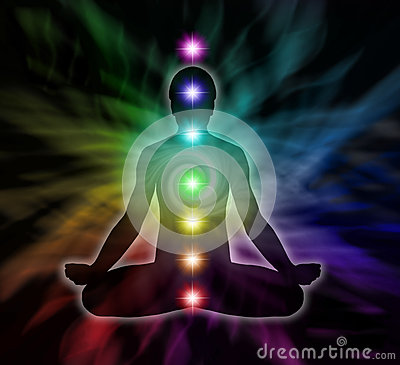 Man In Lotus Meditation Position With Seven Chakras On Flowing Rainbow