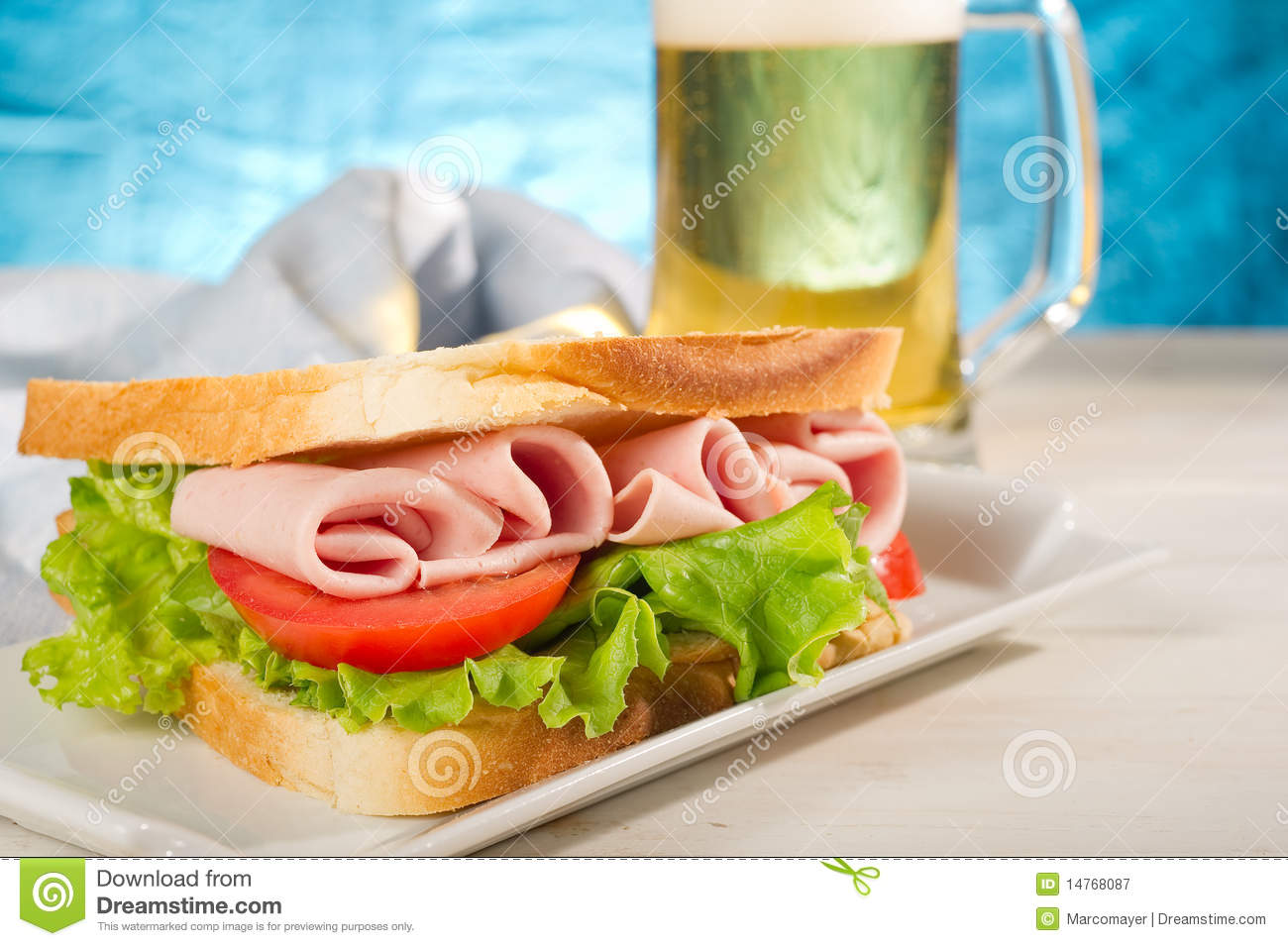 Turkey Sandwich With Lettuce Slice Tomato And Glass Of Beer