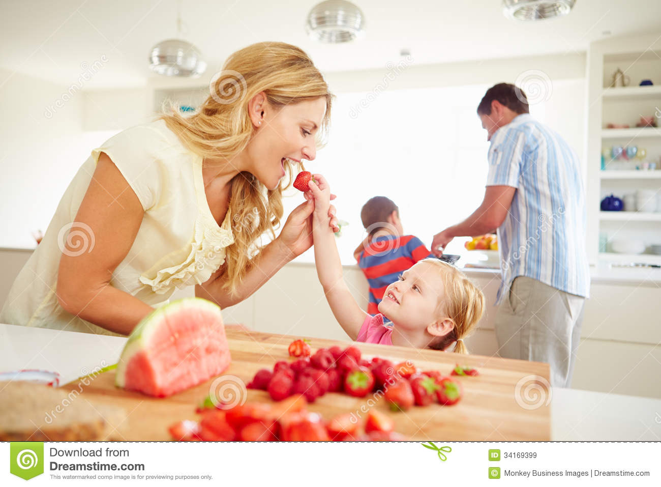 Daughter Helping Mother To Prepare Family Breakfast Royalty Free Stock