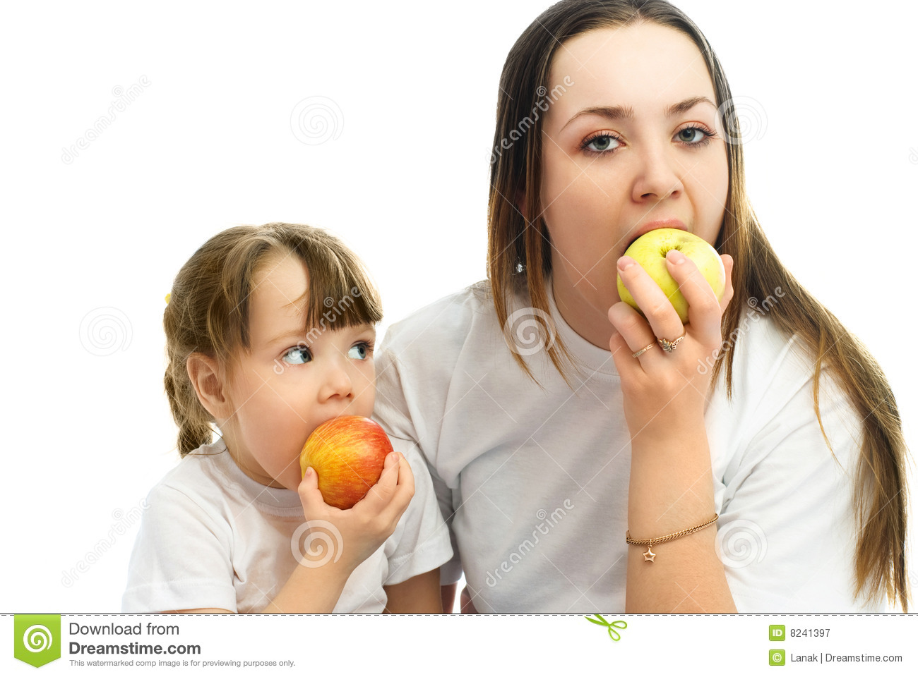 Mother And Daughter Eating Apples Royalty Free Stock Photography