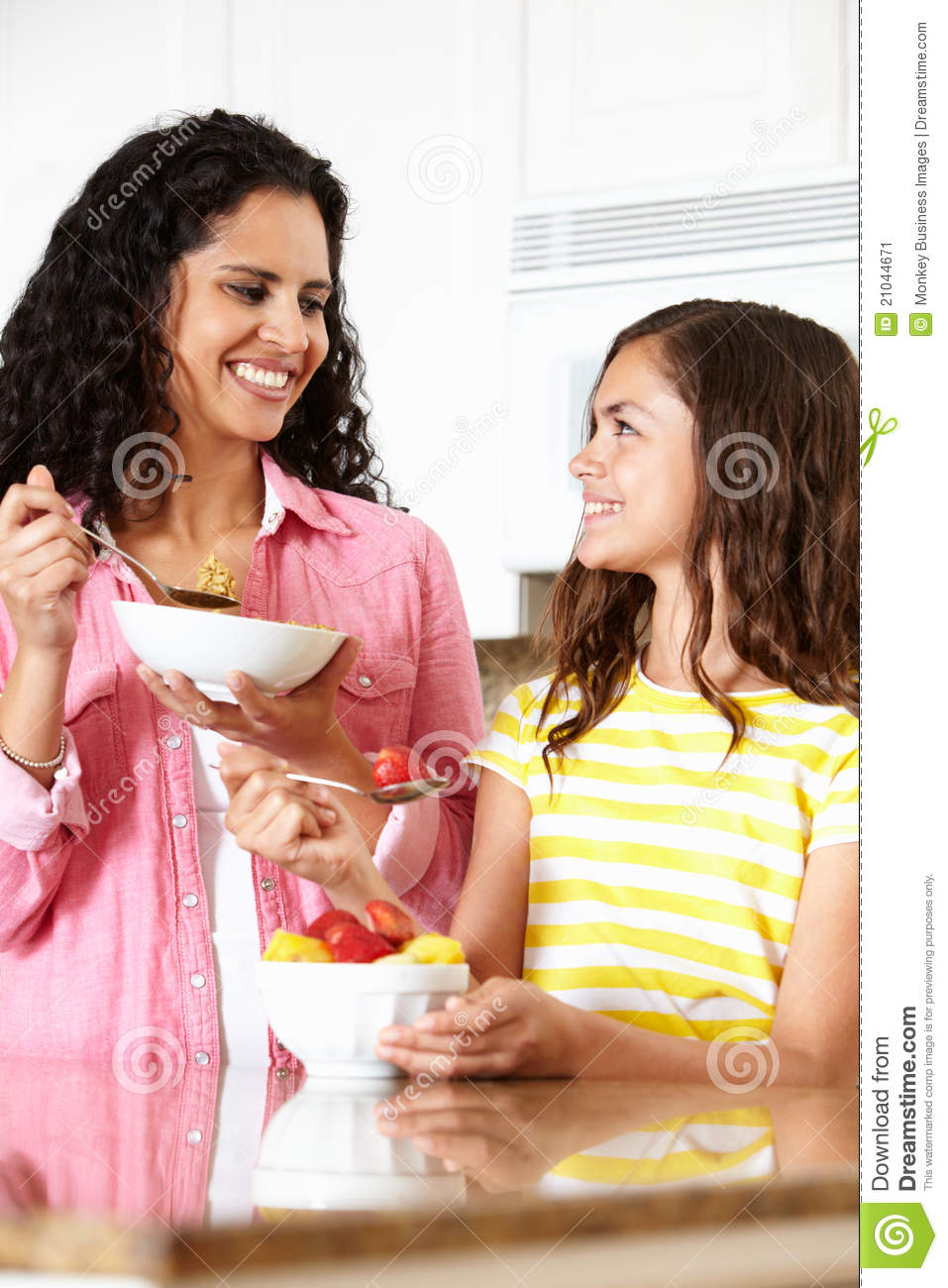 Mother And Daughter Eating Cereal And Fruit Stock Image   Image
