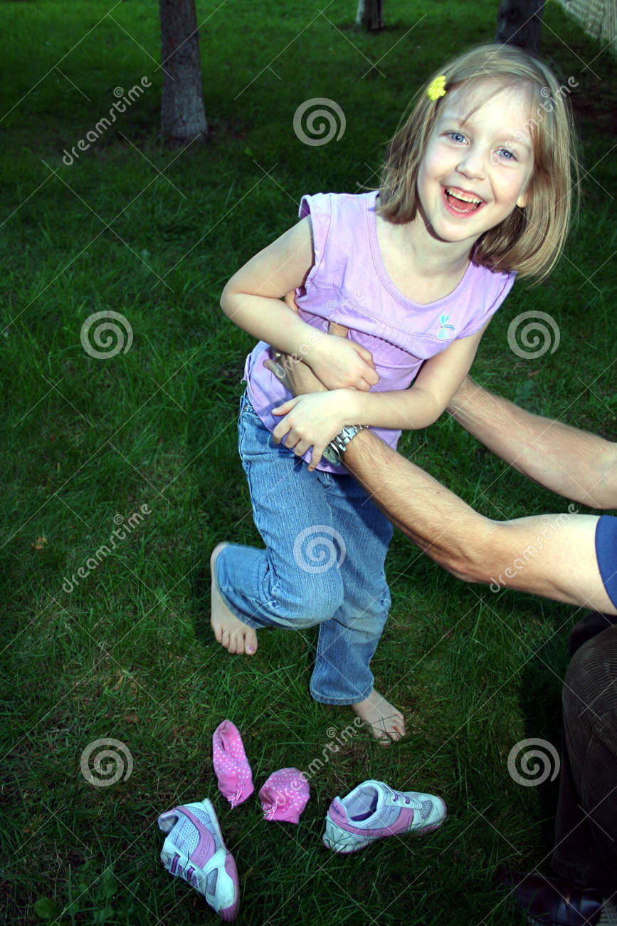 This Little Girl Is Having Fun Being Tickled By Her Dad