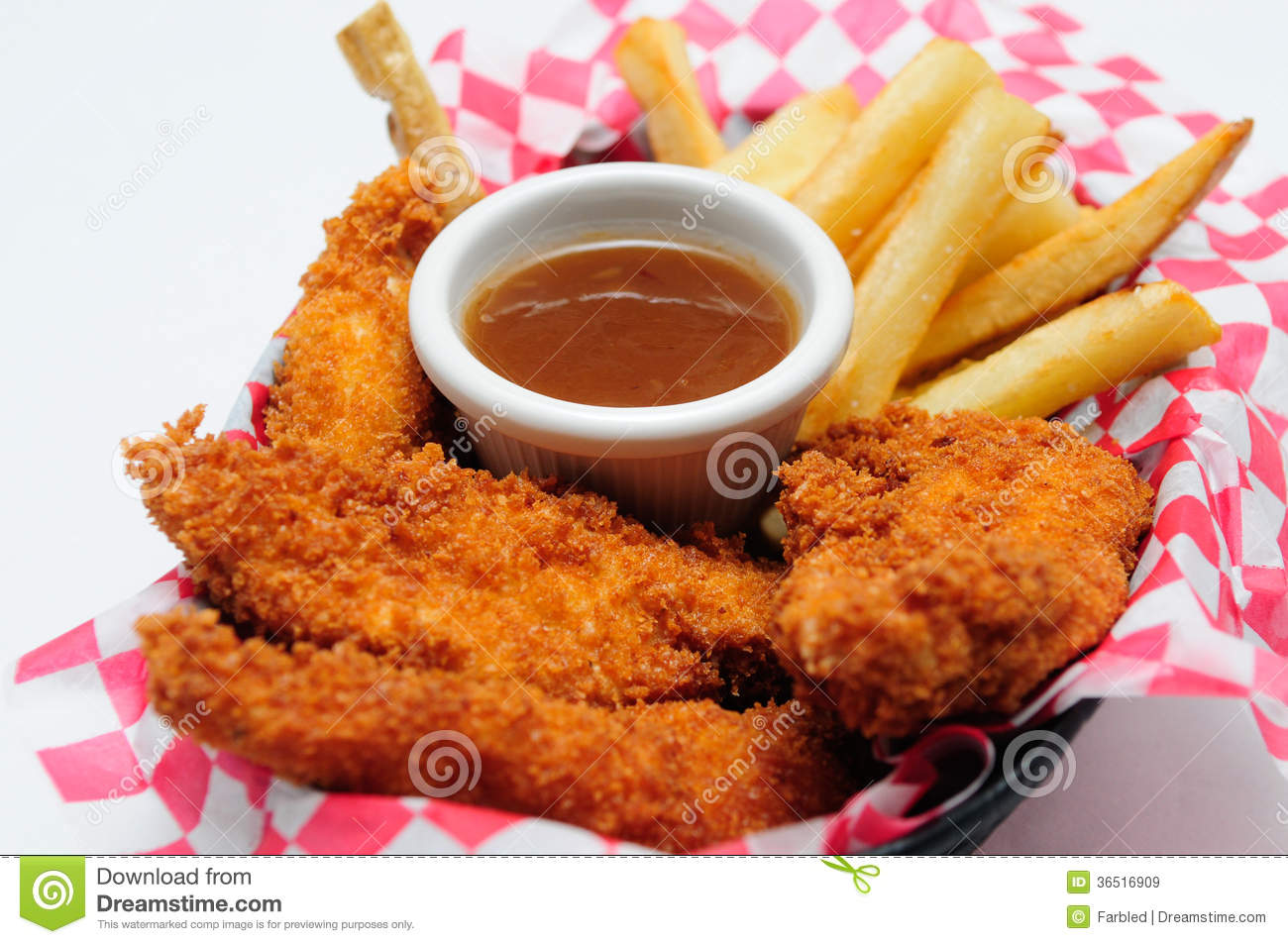     Chicken Strips With French Fries And Dipping Sauce In A Diner Basket
