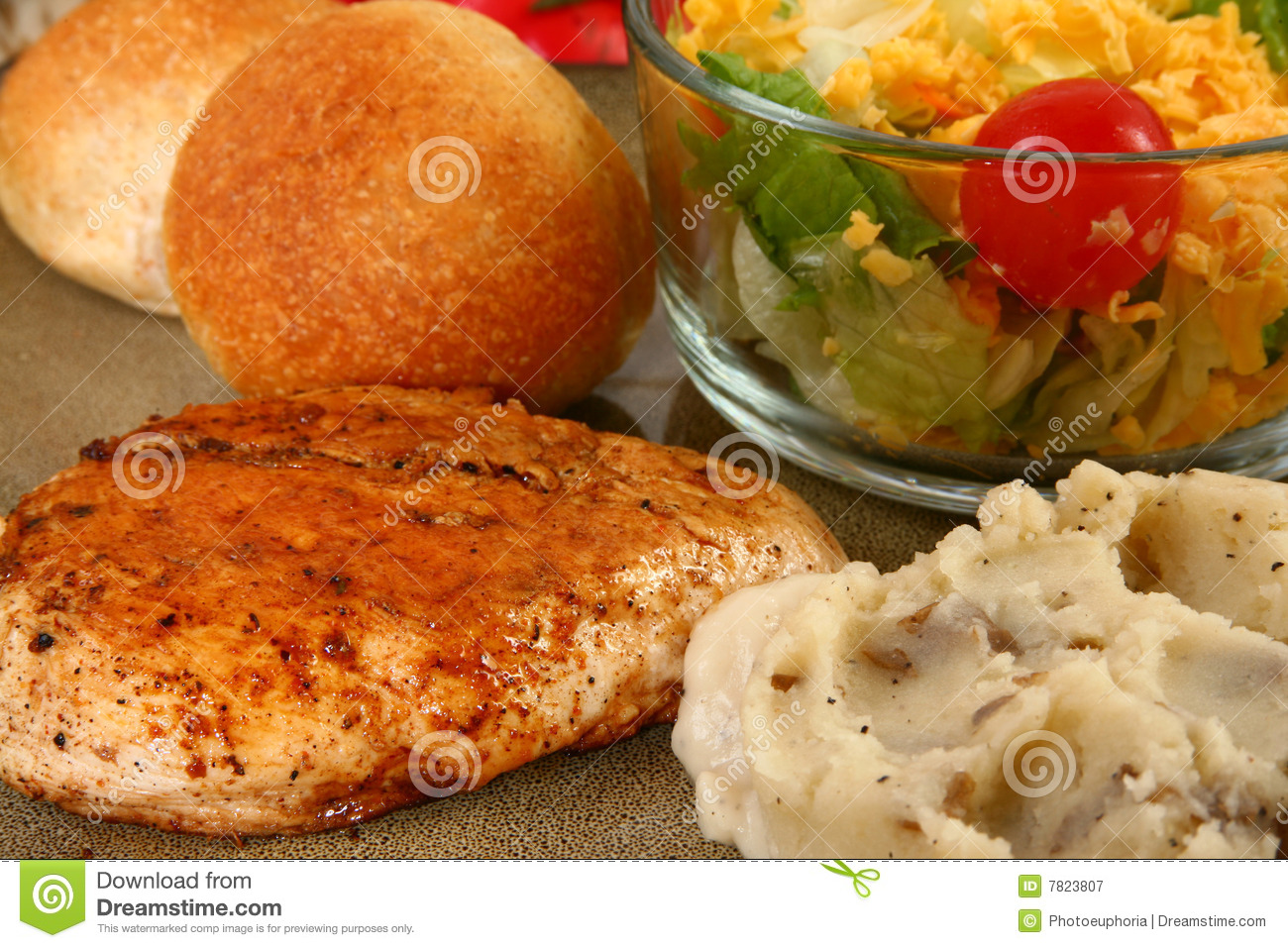 Close Up Of A A Boneless Grilled Chicken Breast Fillet Next To Mashed