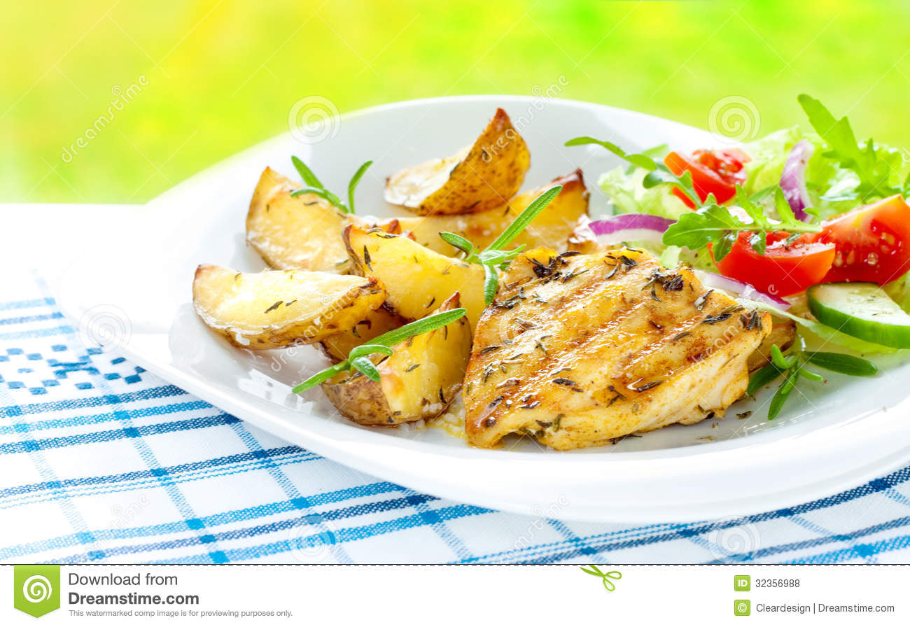 Grilled Chicken Breast Fillet With Potatoes And Salad Royalty Free