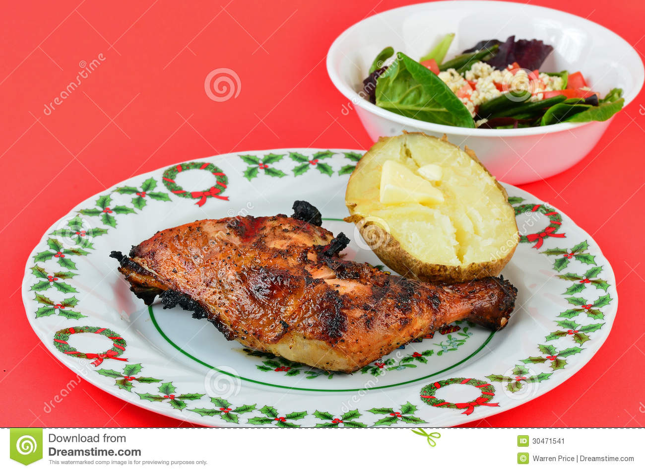 Grilled Chicken Thigh And Leg On Christmas Plate With Baked Potato And