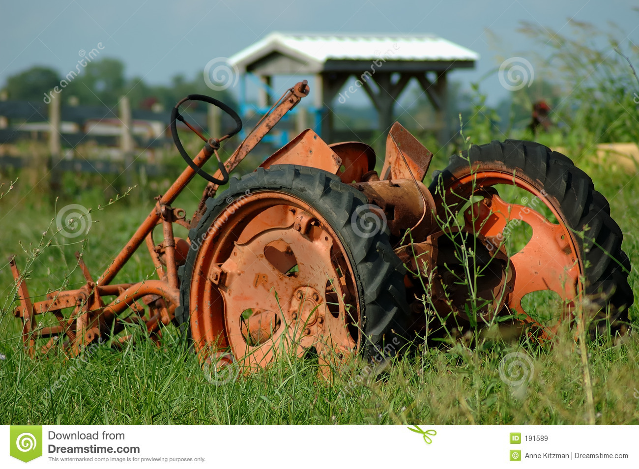 Rusty Old Farm Plow Sits As A Decoration In A Field In The Hills Of