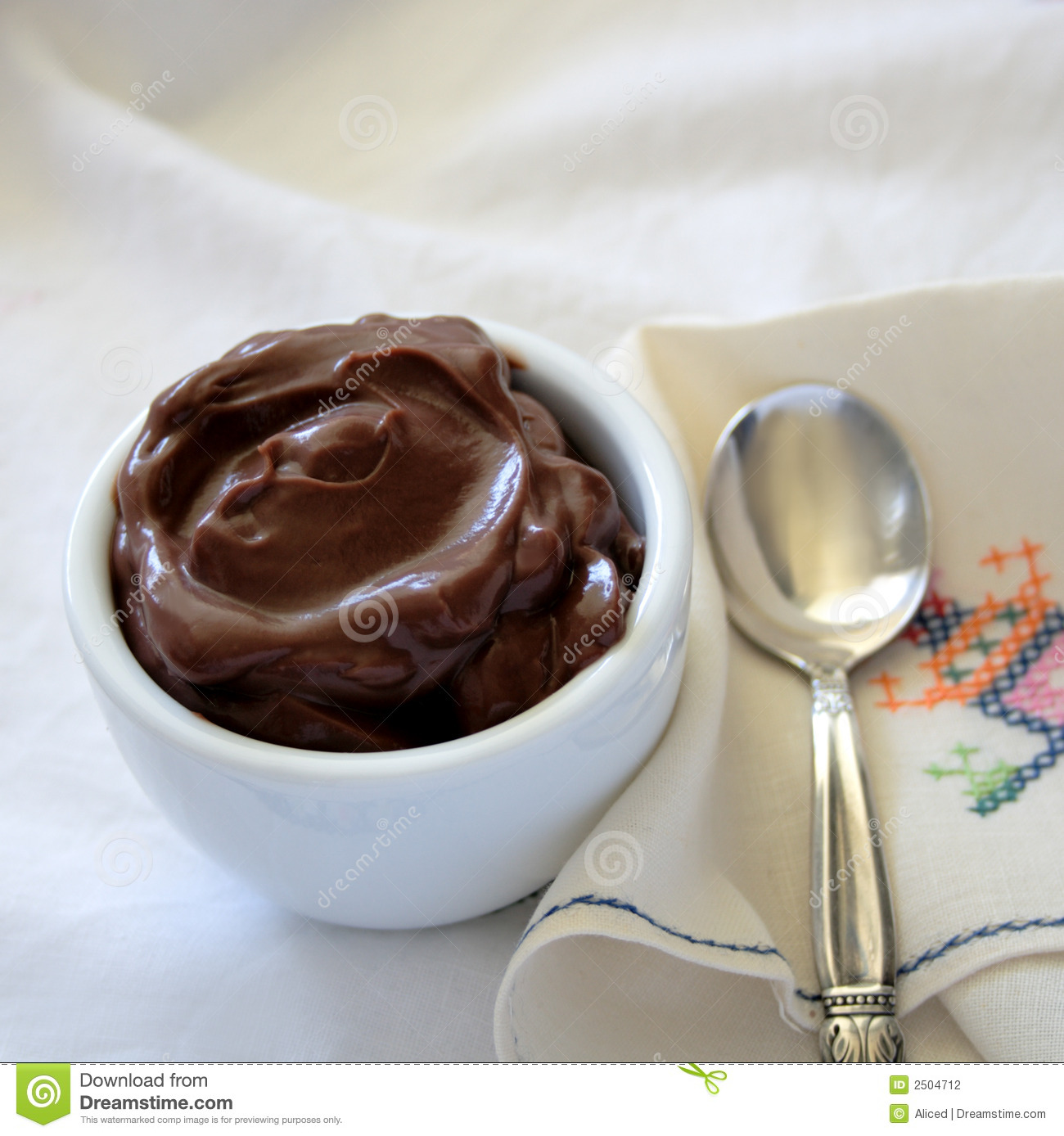 Small Bowl Of Chocolate Pudding With A Silver Spoon On A Vintage