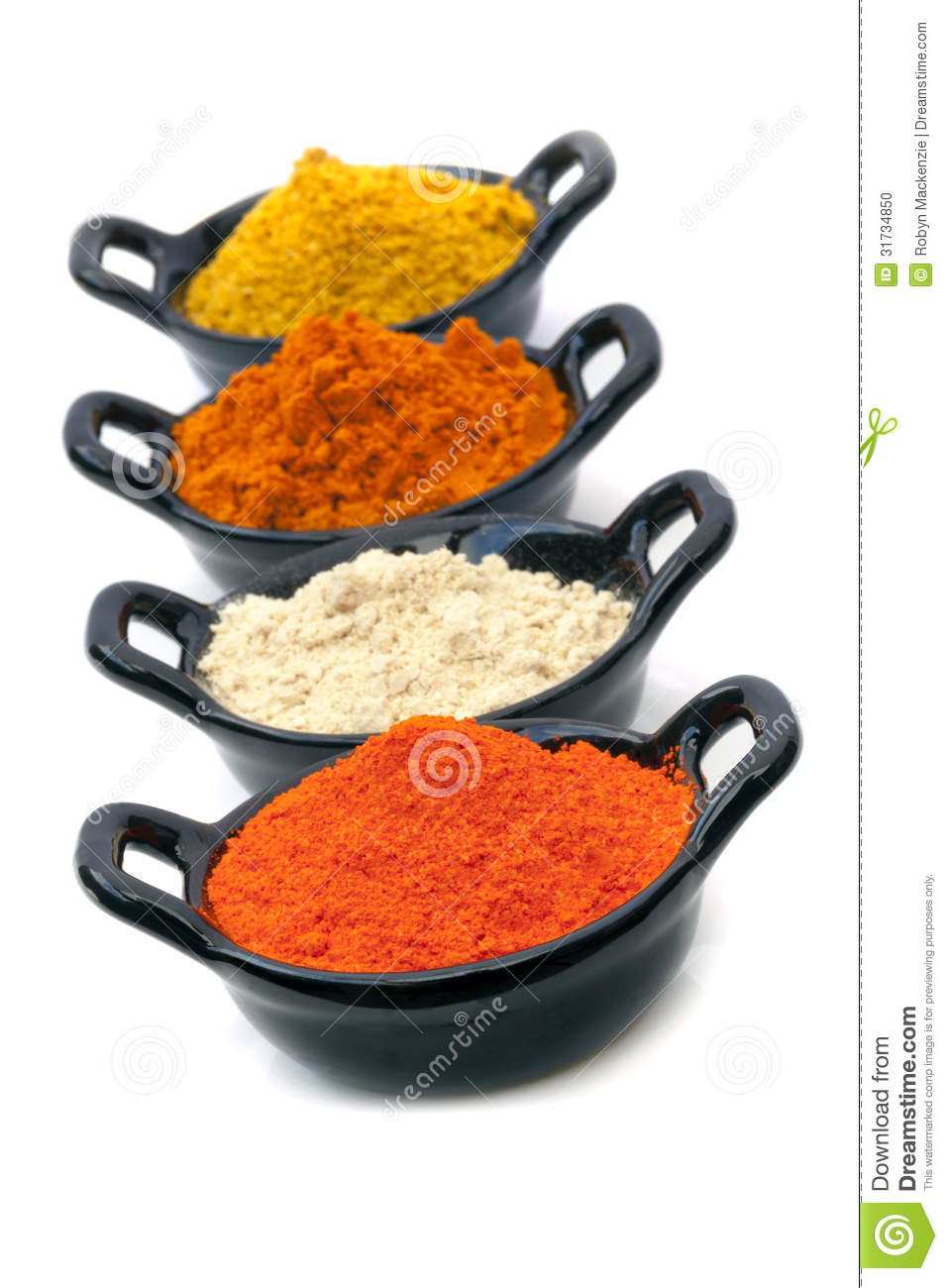 Spices In Small Black Bowls Isolated On White 