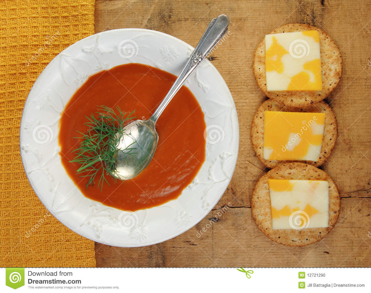 Homemade Tomato Soup With Crackers And Cheese On A Rustic Wooden Table